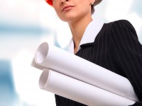 Female architect holding blueprints